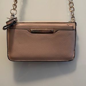 Poppy & Peonies - beige with adjustable strap never used. Gold hardware.